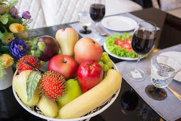 Naklejka na ściany i meble A basket of fruit on table set
