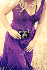 woman purple dress camera