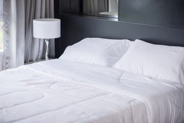 White pillows on comfortable bed