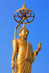 Golden Buddha statues in a Thai Buddhist temple