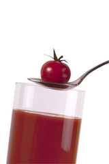Glass of tomato juice isolated on white