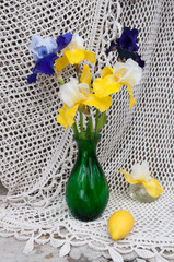 still life bouquet with blue and yellow irises