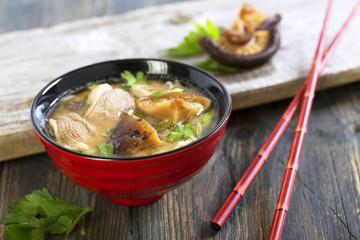 Miso soup with duck breast closeup.
