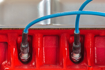 Two spark plugs on a new car engine