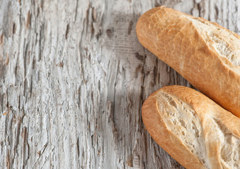 Baguette on the wooden board