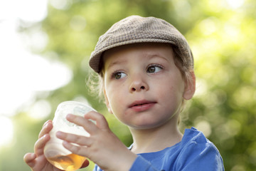 Boy with cup of tea