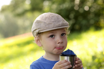 Child with cup of tea