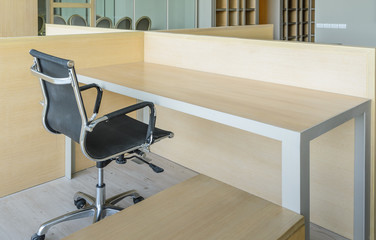 Simple office room with table and chair