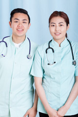 Asian doctors in medical apron with stethoscope
