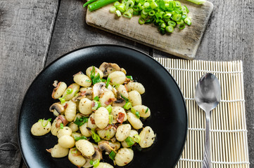 Gnocchi pasta with ham, spring onion