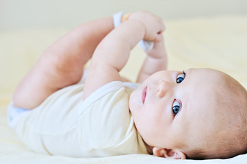 baby playing with legs