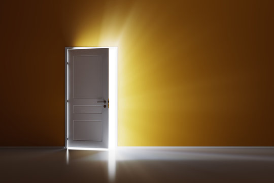 Rays of light through the open white door on orange wall