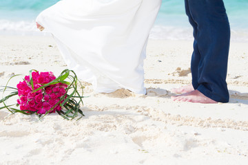 wedding on tropical beach, bride and groom
