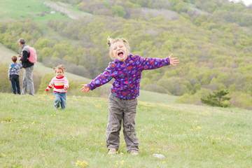 happy family with three kids enjoying free time on natural backg