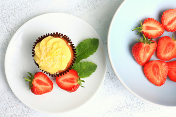 Fresh strawberries in a blue bowl, close up