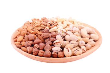 Set of nuts on bowl isolated on white background