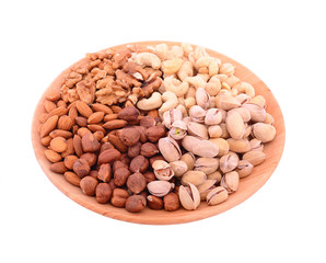 Set of nuts on wooden bowl isolated on white background