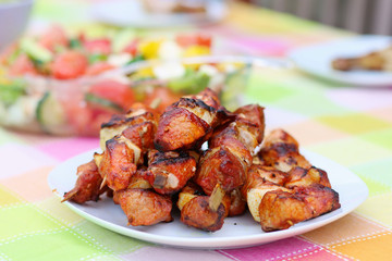 Assorted delicious grilled meat on white plate