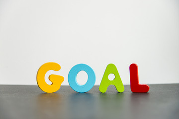 Colorful Wooden word goal with white background3