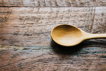wood spoon on wooden table close up