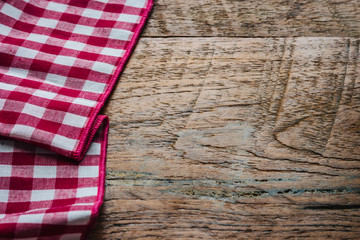 red fabric tablecloth textile on wooden background