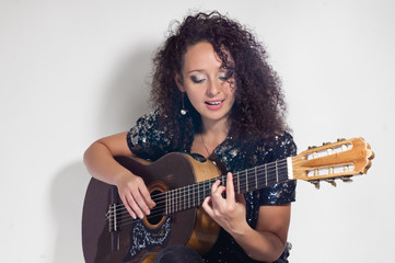 Fototapeta premium woman guitarist and singer