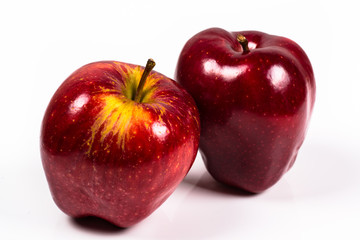 two red delicious apple on a white background