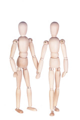 Two wooden dummies on a white background
