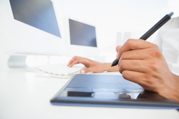 Designer working at desk using digitizer