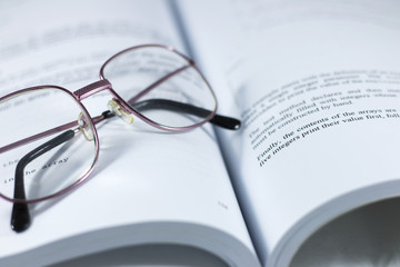 Glasses on the book
