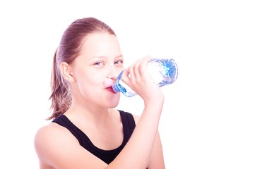 Teen girl drinking water from bottle