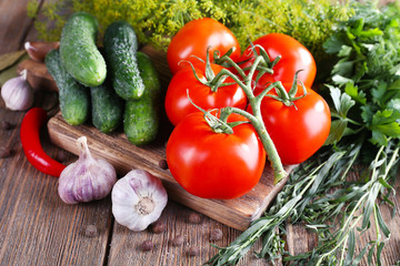 Fresh vegetables with herbs and spices on table, close-up