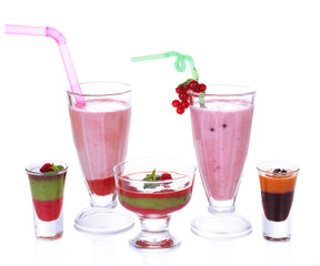 Glasses of tasty smoothies and milk shake, isolated on white