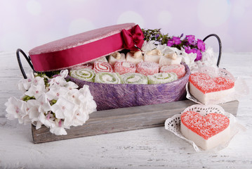 Present box with sweets and flowers