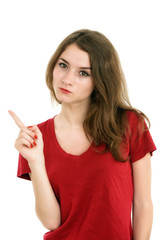 Young smiling woman points a hand with positive facial expressio