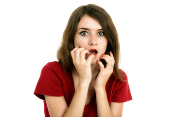 Shocked girl covers her mouth with hands, isolated on white