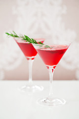Cranberry drink with rosemary, selective focus