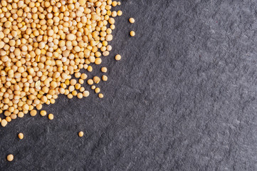 Mustard seeds on dark background