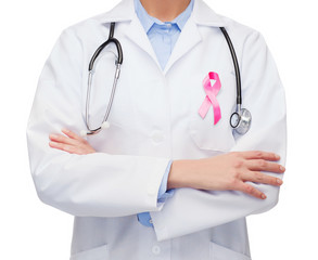 female doctor with breast cancer awareness ribbon