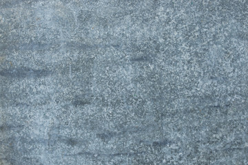 The vintage gray rusty grunge iron metallic textured background