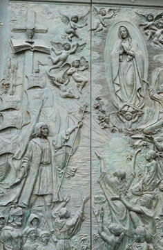 Relief bronze doors of cathedral. Madrid, Spain