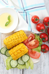 Grilled corn cobs on table, close-up