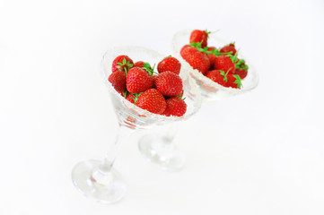 Elegant martini glass filled with juicy fresh strawberries and s