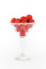 Elegant martini glass filled with juicy fresh strawberries and s