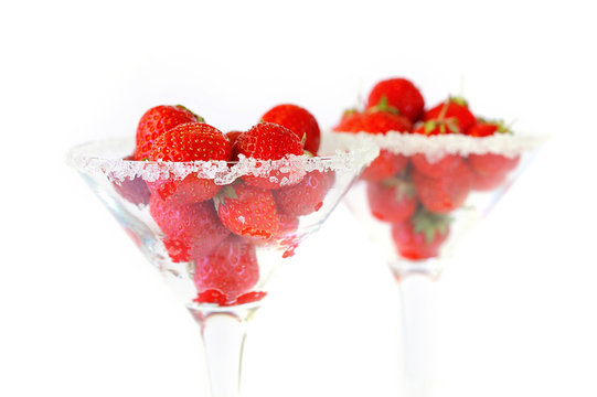 Elegant martini glass filled with juicy fresh strawberries and s