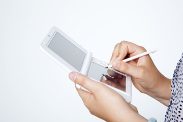 Girl playing video game against gray background