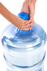 Girl hands with a large mineral water container