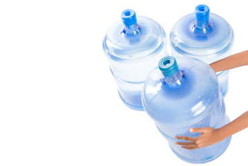 Girl hands with a large mineral water container