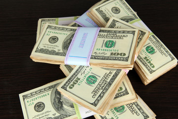 Stacks of money on wooden table
