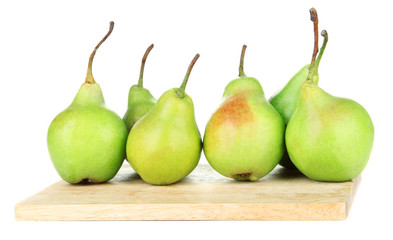 Pears on wooden cutting board, isolated on white